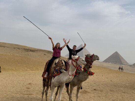 Ed and his daughter ride camels in Egypt