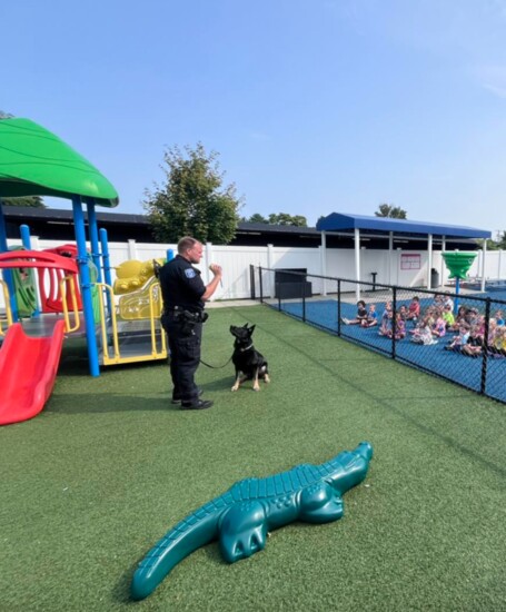 The department's K-9 team visits kids at The Learning Center. 