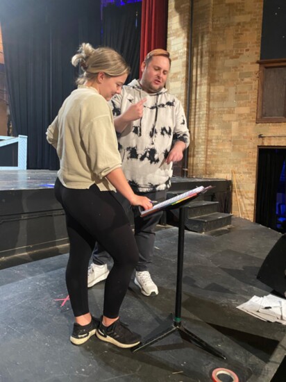 Director Justin Larman and choreographer MacKay Adams work through blocking and traffic patterns in a recent rehearsal.