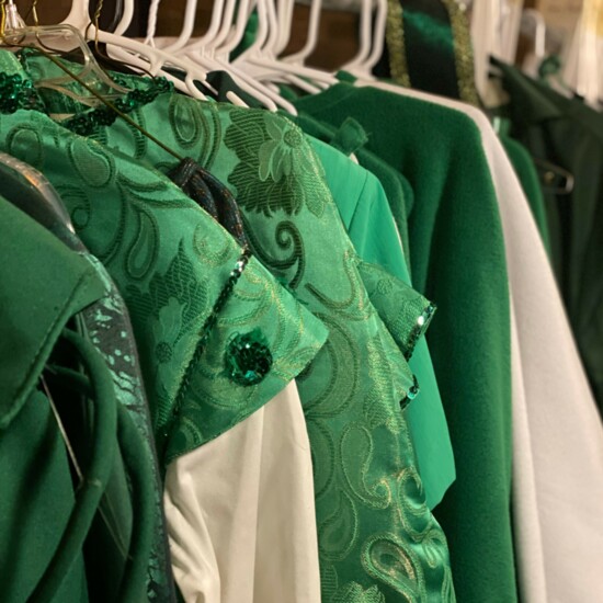 Costumes for the ensemble of The Wizard of Oz are hung once they have been fitted on cast members.