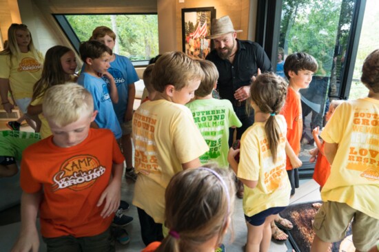 Zac greets campers in the Treehouse