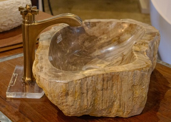 Add an organic touch to your bathroom with a carved vessel sink.