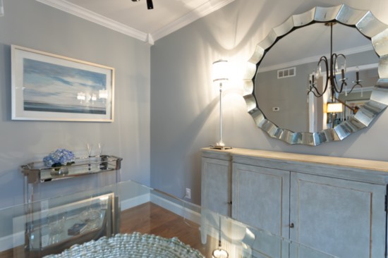 Dining room decadence— new lamps, a mirror and bar cart were added to complete the room.