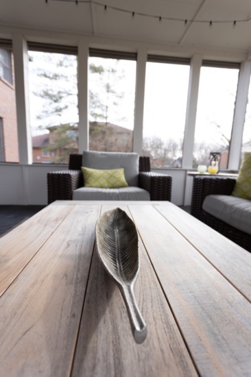 From old to new, Nicole refreshed the back porch (which wasn't utilized much previously) with accessories and patterns to make the area inviting. 