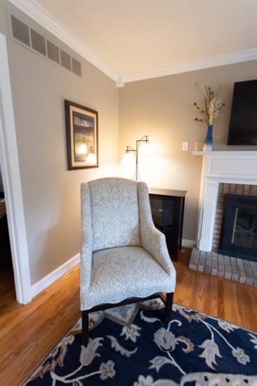 Two wingback chairs were reupholstered, old blinds were swapped for custom roman shades, and new artwork, lamps and accessories finished the room. 