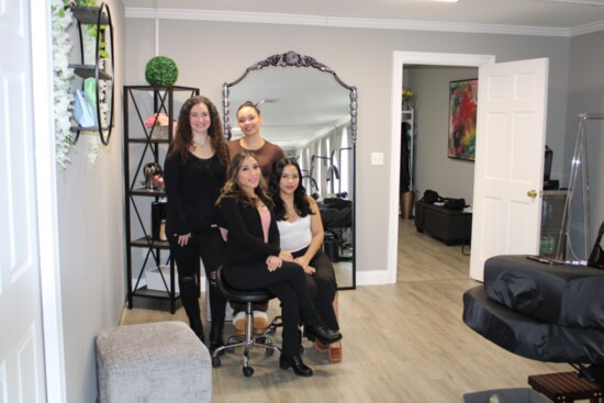 Lash and Glow's staff, clockwise from bottom left, Carla Peralta, Jordan Galvin, Louisette Davila and Yennifer Ibanez 