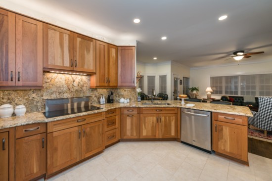 Kitchen: Wellborn Premier cherry cabinets, Solarius granite counter and backsplash