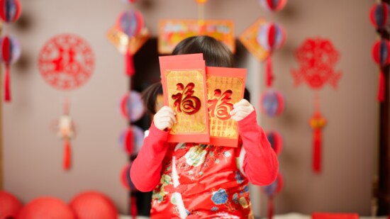 A Chinese child celebrates Lunar New Year