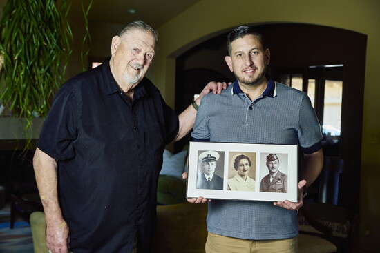 Gary and Luke Luchini. Here, Luke is holding photos of Gary's uncles and mother.