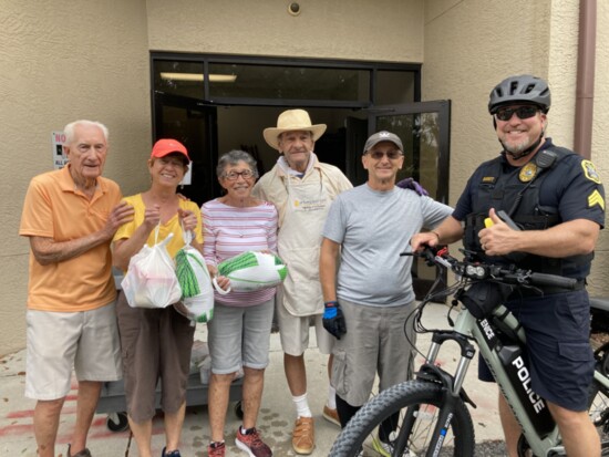 Hammett with community members who pre-registered to receive free Thanksgiving turkeys from the Salvation Army in Venice. 