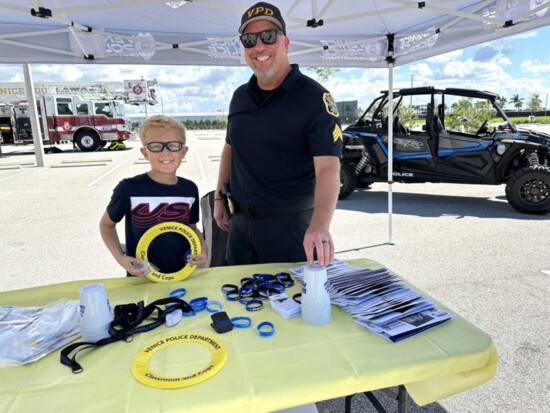 Venice Police Department’s community service officer Hammett with a friend at a Public Safety Day event in Wellen Park.