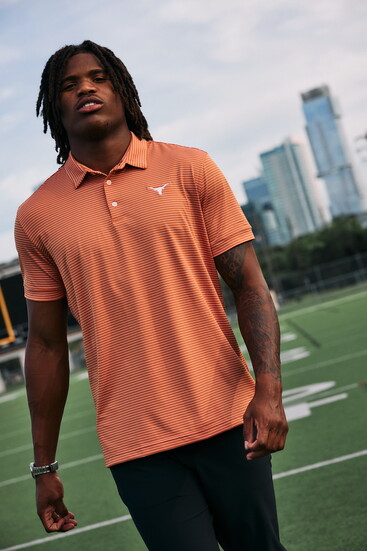 M+M's burnt orange alternating stripe University of Texas Versa Polo, black solid Helmsman chinos.