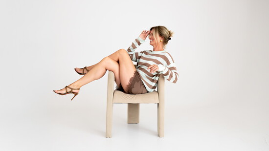 OGD “Sloane” cashmere sweater, Elodie The Label “Kaia” silk shorts, and Jenny Bird “Nelle” ring and “Mega Lennon” bangle, available at Bivouac.