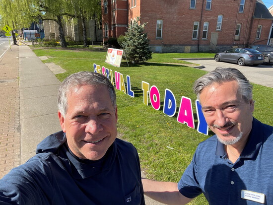 Doug Emblidge at Rochester Hope food pantry with a Rochester Hope board member