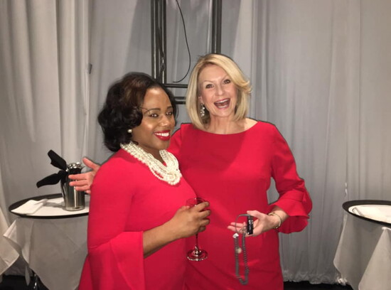 Ginny Ryan emceeing the Athena Awards