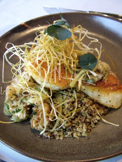 Chilean Sea Bass with quinoa, roasted mushrooms & fennel, crispy leeks, and bone marrow compound butter