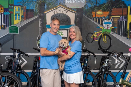 Ray, Pamela and their beloved Chloe in their electric bicycle shop, Big Bam eBikes.