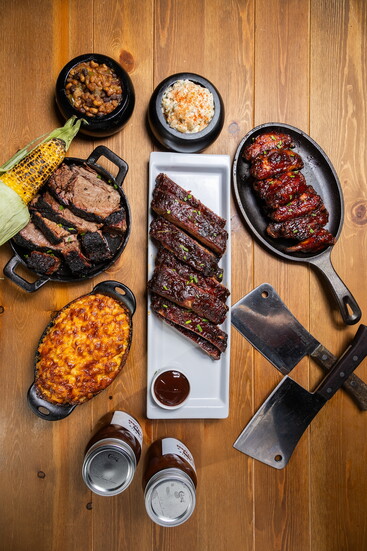 Beef Brisket, Mac 'n Cheese, Ribs (center) Smoked Wings, Potato Salad, Zesty Baked Beans, Grilled Corn