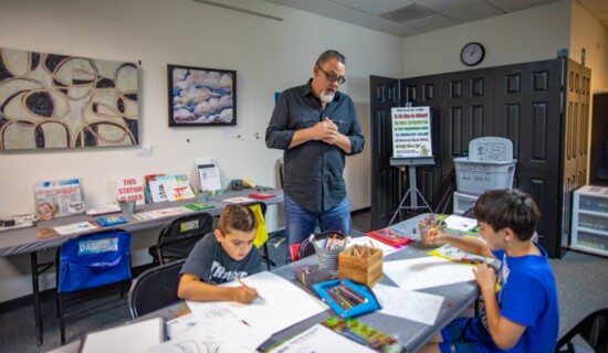 Moramarco observes his students carefully as they work diligently. 