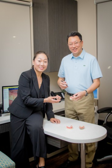 Drs. Sooji Lee and Ritchie Park show their patients how easy it can be to take care of dentures.