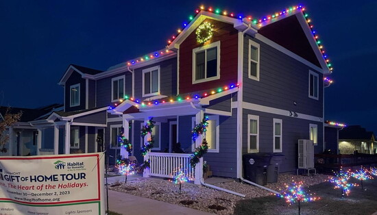 Blingle outfitted this home with vibrant roofline lights, garlands, and glowing yard accents for the holidays.