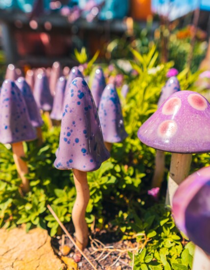 Funky purple garden mushroom figures.