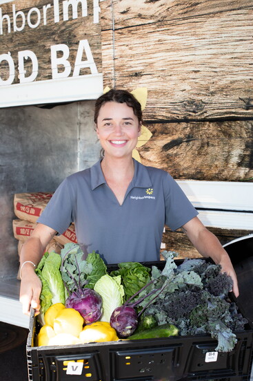 Lennon Lott, Mobile Pantry Specialist, with produce from the NeighborImpact Mobile Pantry. 
