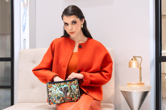 Liviana Conti, wool short jacket, $728 | Mary Frances Wild Elephant bag, $288