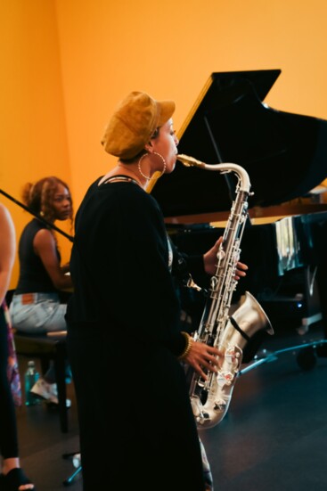 Orange Coffee (stage name of Katty Rodriguez), Grammy Award-winning saxophonist for Beyonce, performs at the Norman Public Library West.