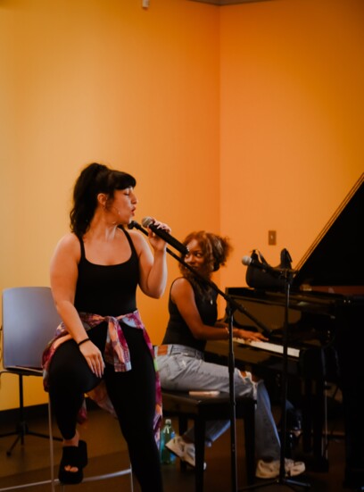 Shira Elias, lead singer of Turquaz and Cool Cool Cool, takes the mike during the Resonance Series performance at the library.