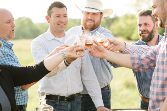 Boro Bourbon Club members giving a 'cheers' to one another.