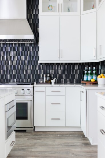 White cabinets create the perfect backdrop for a bold showstopper backsplash.