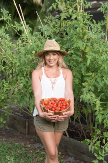 Emily with a single day's harvest of cherry tomatoes. 
