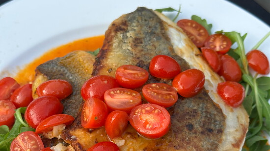 Sautéed Lemon Garlic Branzino with Warm Tomato Salad Over Baby Arugula