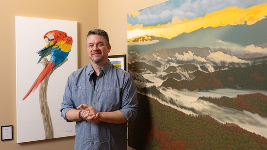 Brett Mistak in front of his painting "First Light"