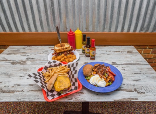 A Brewburgers' American cheeseburger, the 'Maddy B.'—a bacon and herb cheeseburger between two grilled cheeses—and a Brew House salad with grilled chicken