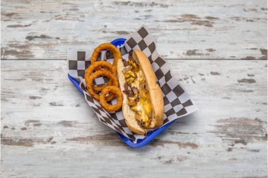 “Your Basic Kind of Cheesesteak”—Shaved Angus beef with grilled onions and American and provolone cheeses on a hoagie