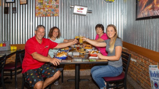 Left to right: Brewburgers’ owner, Michael Bacon; Car Doc on The Island's Toni Marie Franco and Anna Velickovich; and Brewburgers' Madison Sanders