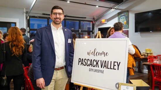 Publisher Anthony Rizzo with welcome Sign by cxb.Design