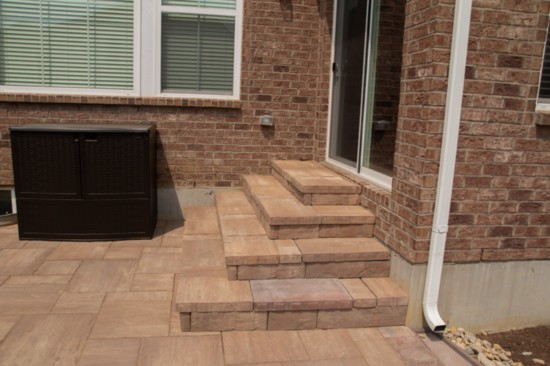 Finer Lawn built the patio, fire pit and stairs in our own publisher's backyard. 