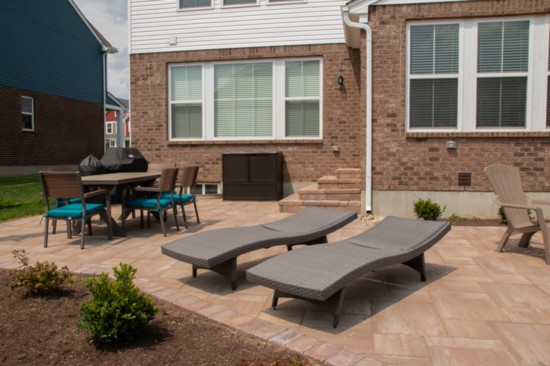 Finer Lawn built the patio, fire pit and stairs in our own publisher's backyard. 