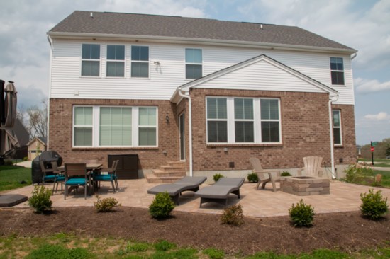 Finer Lawn built the patio, fire pit and stairs in our own publisher's backyard. 