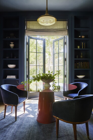 The library/game room has a dark and cozy color palette