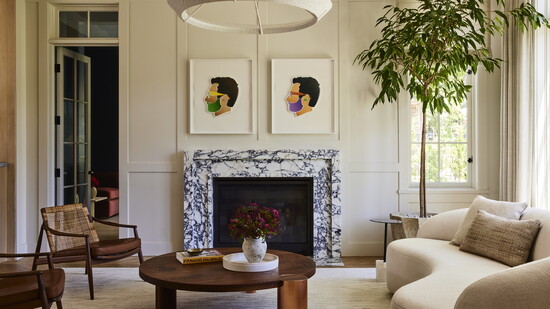 The living room features a custom sofa, vintage chairs by Hartmut Lohmeyer and paintings by Alex Israel
