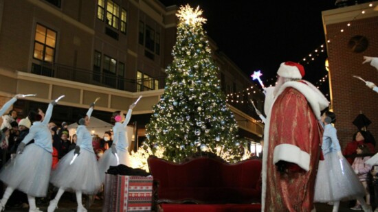 Santa watches the Snowflake Waltz dancers at last year's stroll. 