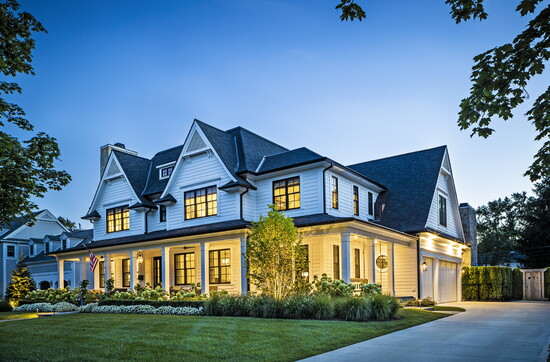 This new traditional custom home in Birmingham features a wraparound front porch.