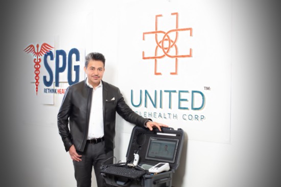 Dr. Nima Ghadimi, president of UTC and SPG, with a Transportable Exam Station (TES)