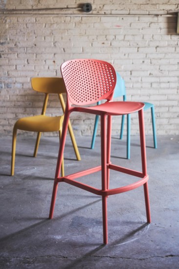 The Bailey Bar Stool is designed for indoor or outdoor use. Its perforated back rest allows for proper airflow, ensuring comfort during the warmer months. 