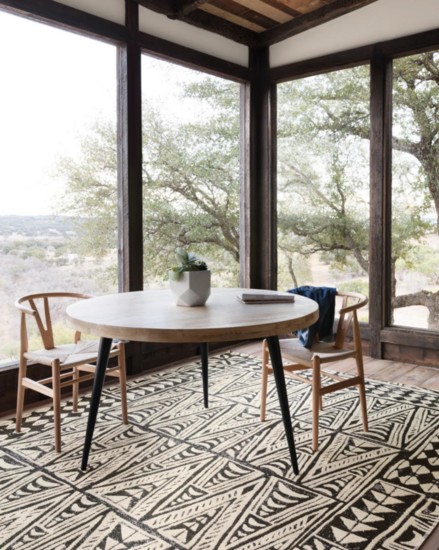 Make sure an area rug fills the space, whether indoors or outdoors.