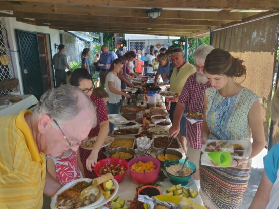 Agape Flights’ missionaries enjoy their Thanksgiving dinner blessings.